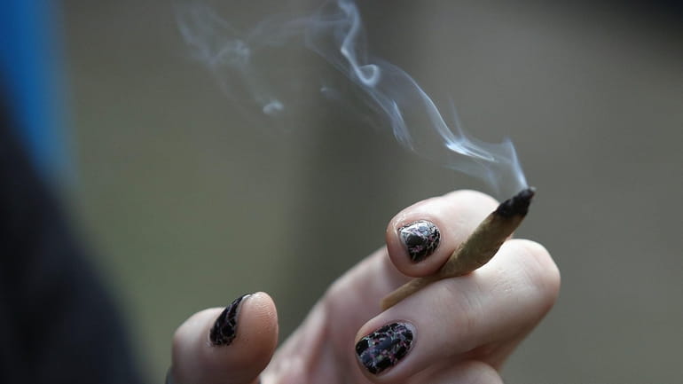 Smoke rising from a marijuana cigarette. 