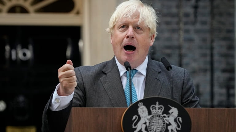 Outgoing British Prime Minister Boris Johnson speaks outside Downing Street...