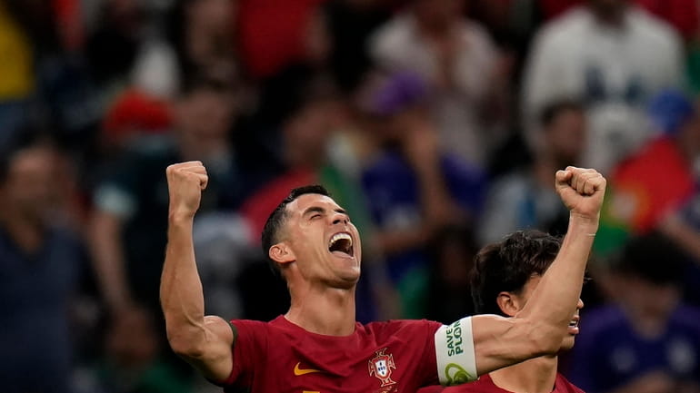 Portugal's Cristiano Ronaldo celebrates his side's opening goal during the...