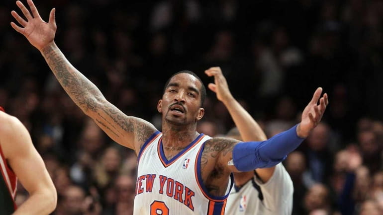 J.R. Smith celebrates after hitting a 3-point shot against the...