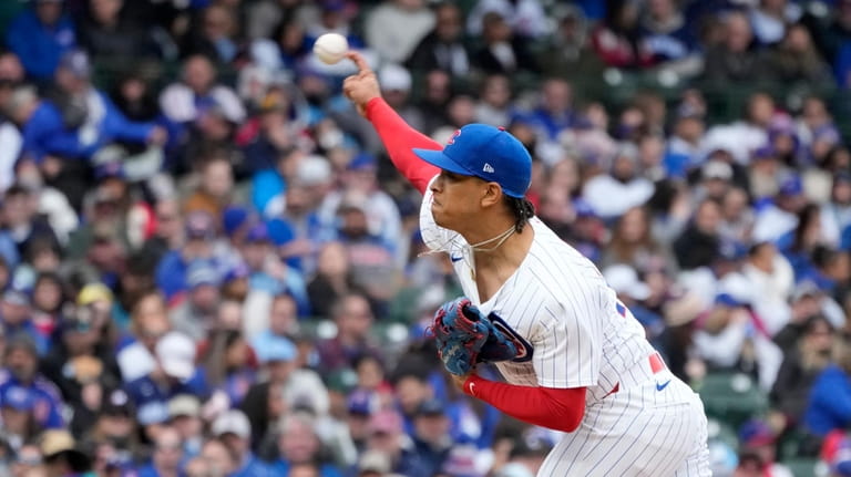 Chicago Cubs pitcher Adbert Alzolay delivers during the eighth inning...