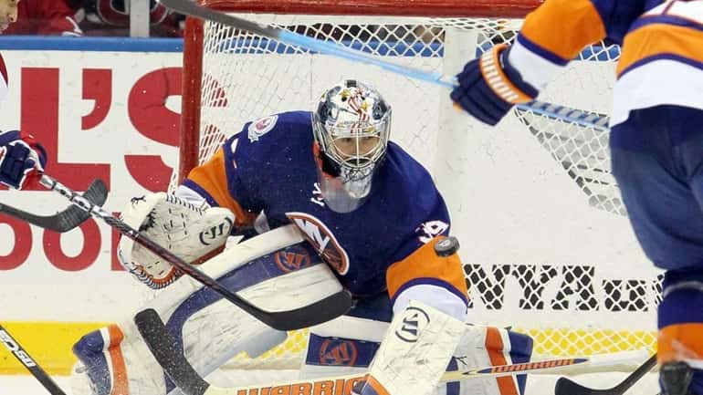 Rick DiPietro #39 of the New York Islanders makes a...