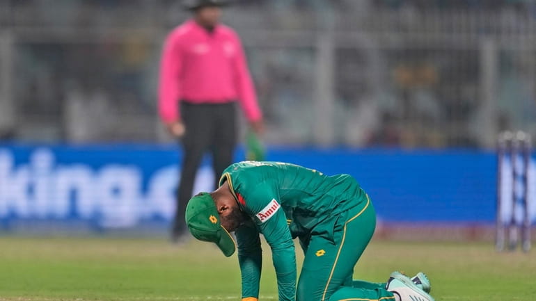 South Africa's captain Temba Bavuma reacts after missing a chance...