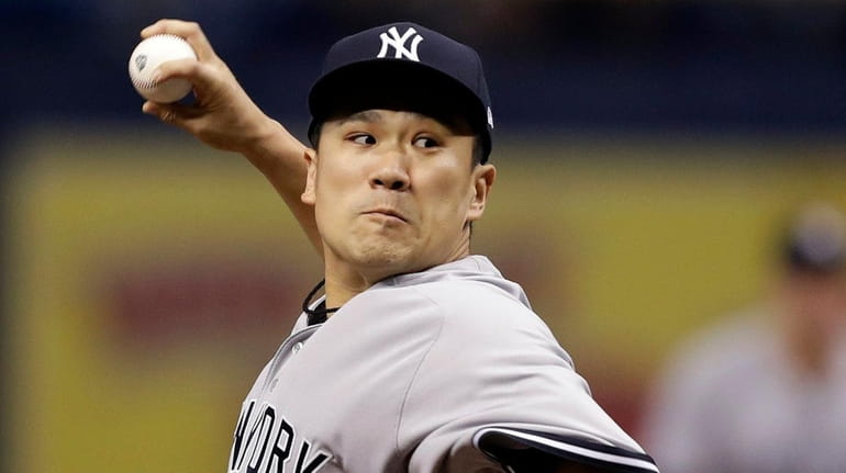 Yankees' Masahiro Tanaka, of Japan, pitches to the Tampa Bay...