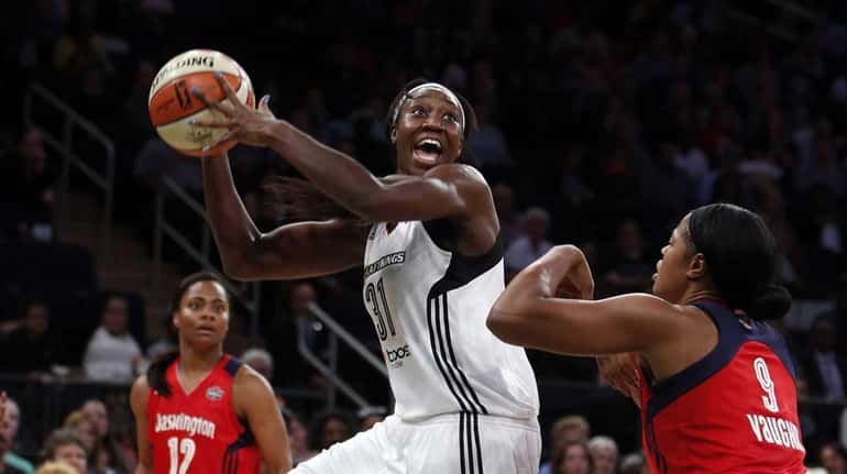 New York Liberty's Tina Charles (31) looks to shoot against...