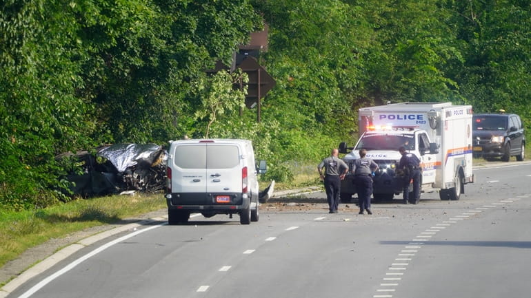 Investigators at the scene July 24 on the Northern State Parkway...