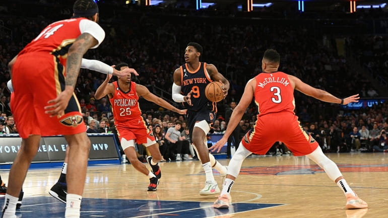 New York Knicks guard RJ Barrett drives into the paint...