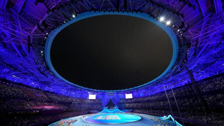 Artist perform ahead of the opening ceremony of the 19th...