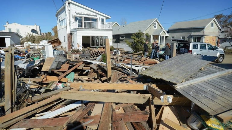 Houses damaged by superstorm Sandy on Nov. 4, 2012, along...