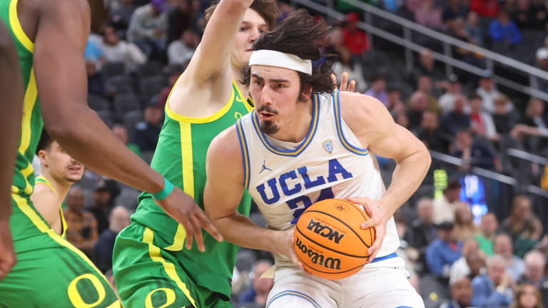 UCLA guard Jaime Jaquez Jr. (24) drives to the basket...