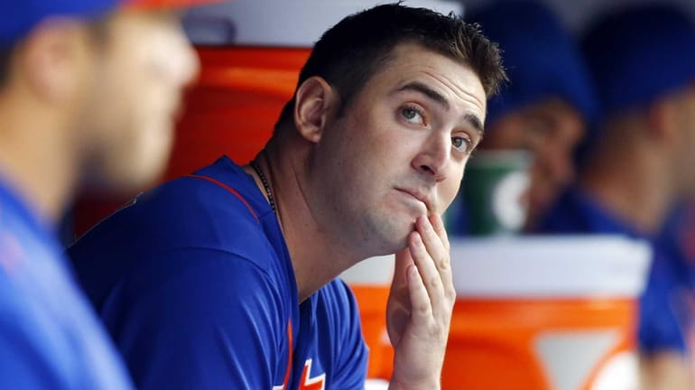 Matt Harvey of the New York Mets looks on from...