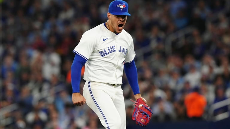 Toronto Blue Jays pitcher Jose Berrios reacts during fifth-inning baseball...