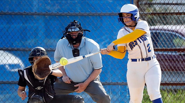 West Islip's Brianna Adams drives a two-run double to right-centerfield...
