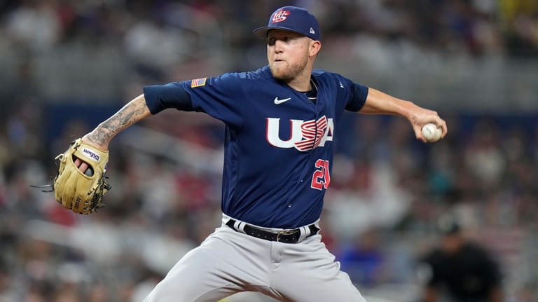U.S. pitcher Kyle Freehand (21) throws during fourth inning of...