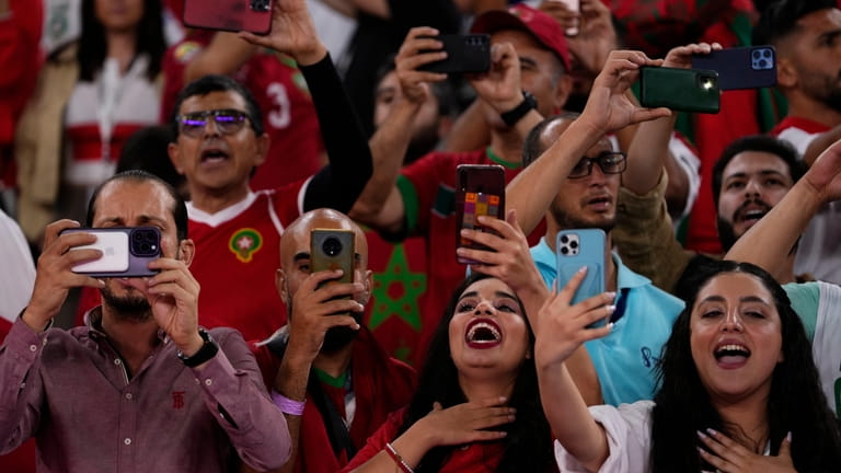 Morocco fans cheer prior of the World Cup group F...