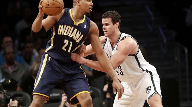 Brooklyn Nets' Kris Humphries, right, guards Indiana Pacers' David West...