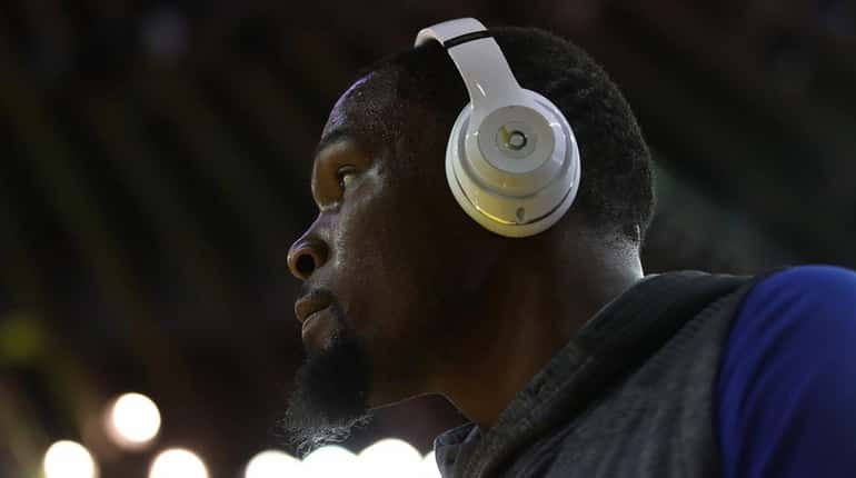 Kevin Durant #35 of the Golden State Warriors warms up...