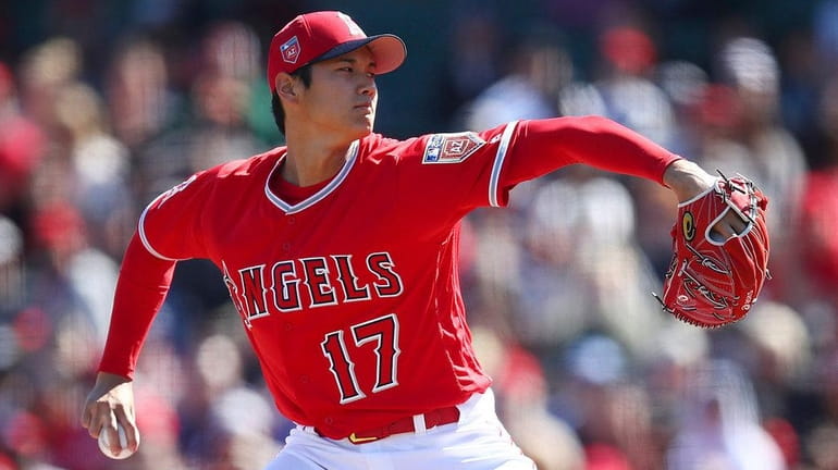 The Angels' Shohei Ohtani works against the Brewers during the...