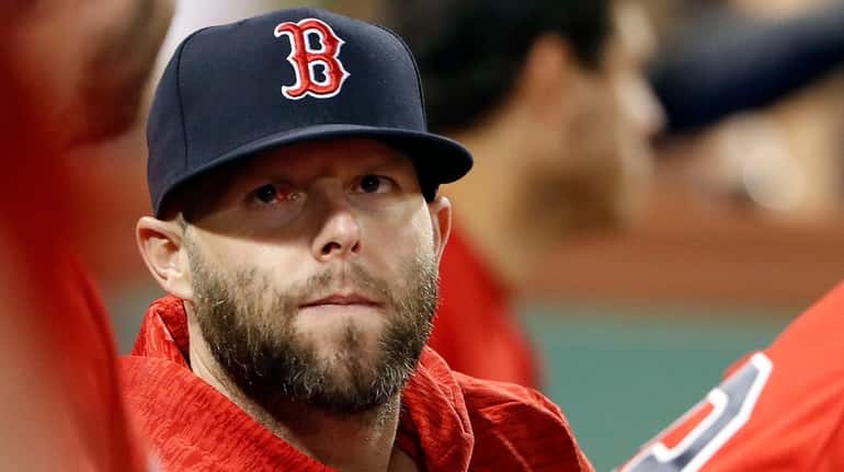 Boston Red Sox second baseman Dustin Pedroia looks on from...