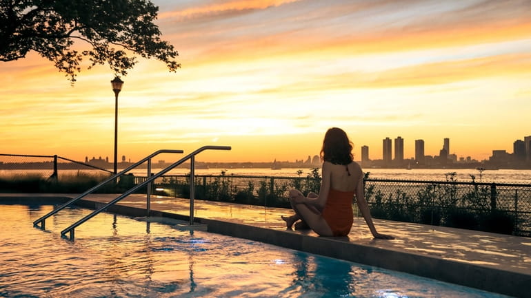 The picturesque Manhattan skyline and sunsets are visible from QC NY,...
