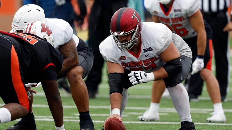 National offensive lineman Jake Andrews of Troy (77) runs drills...