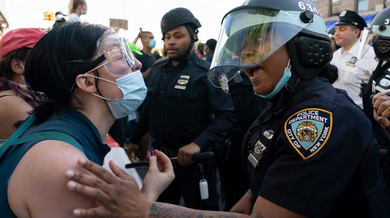 Demonstrators clash with police in Flatbush, Brooklyn, on Saturday.
