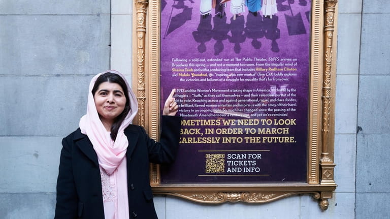 This photo provided by Rubenstein shows Malala Yousafzai pointing to...