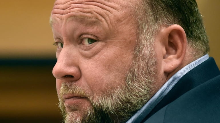 Infowars founder Alex Jones appears in court to testify during...