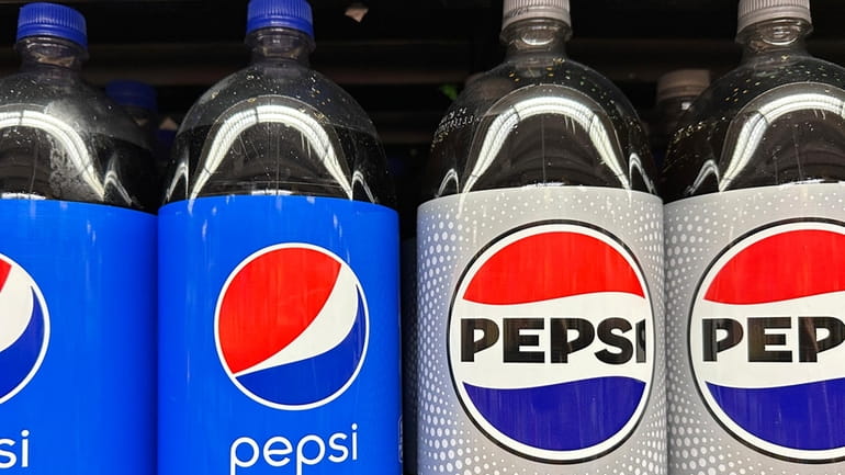 Plastic bottles of Pepsi are displayed at a grocery store...