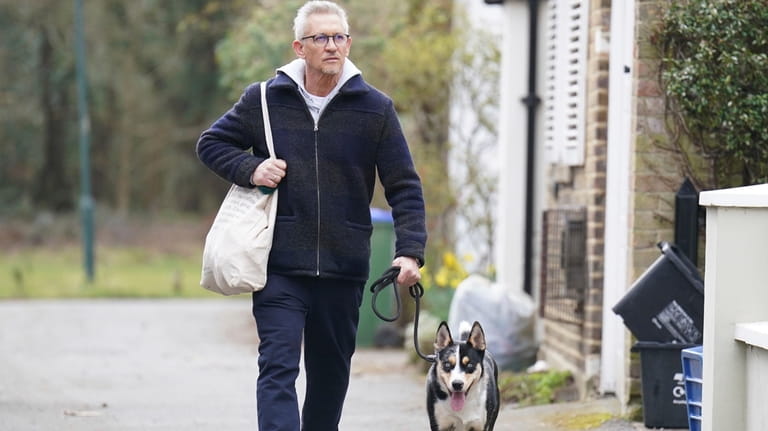 British soccer broadcaster Gary Lineker returns home after walking his...