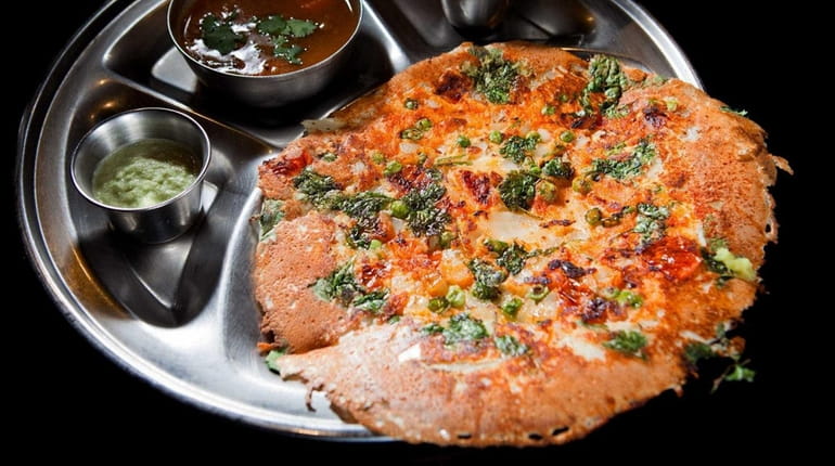 Mixed vegetable uttapam is served at House of Dosas, a...