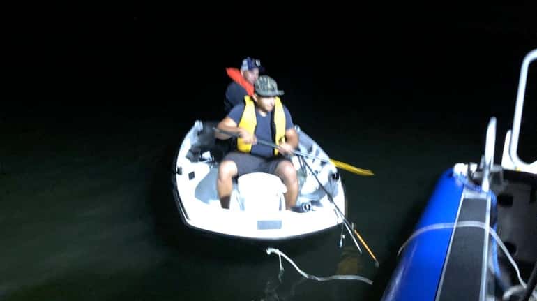 Suffolk County Police Marine Bureau officers Monday night rescued two...