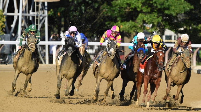 In this photo provided by NYRA, Arcangelo, second from left,...