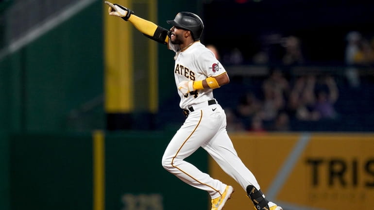Pittsburgh Pirates' Joshua Palacios rounds the bases after hitting a...