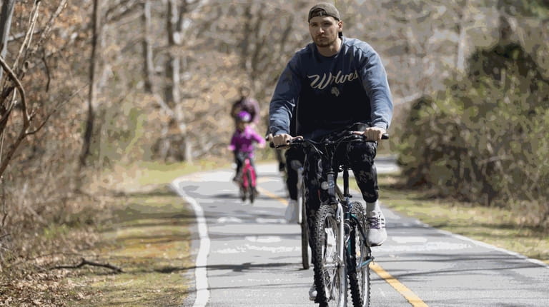 Bikers are seen at Bethpage bikeway, in Bethpage State Park.