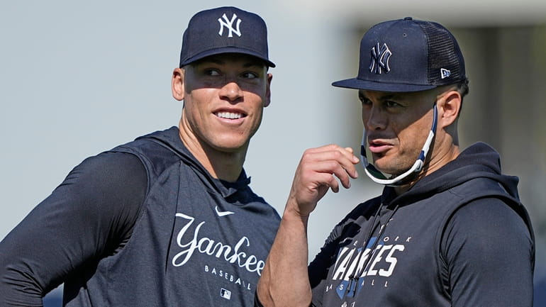 The Yankees' Aaron Judge, left, and Giancarlo Stanton look to...