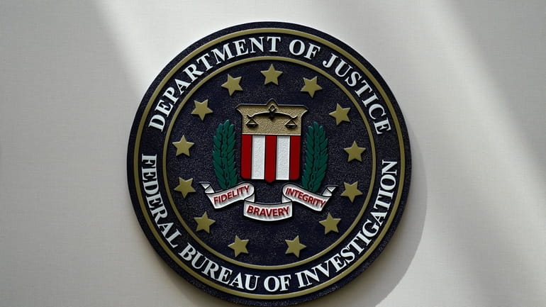 The FBI seal is pictured in Omaha, Neb., Aug. 10,...
