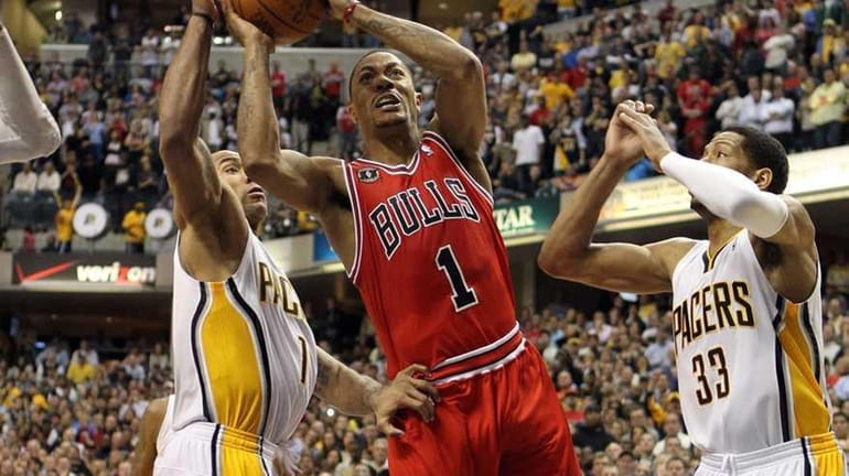 Derrick Rose #1 of the Chicago Bulls launches the game...