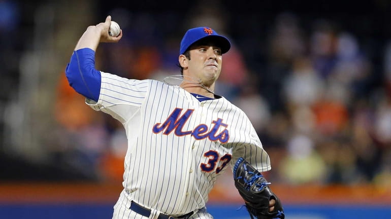 Matt Harvey of the Mets pitches against the Colorado Rockies...