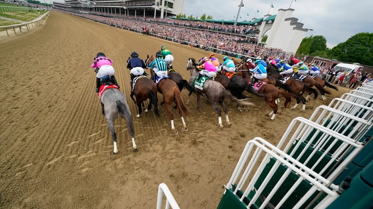 Horses leave the starting gate during the 149th running of...