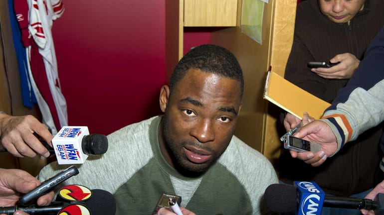 Justin Tuck addresses the media after cleaning out his locker...