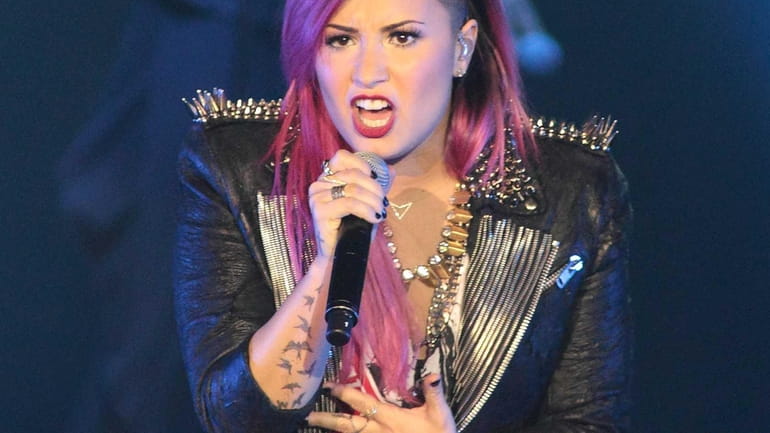 Demi Lovato performs during her "Neon Lights Tour" on Tuesday,...