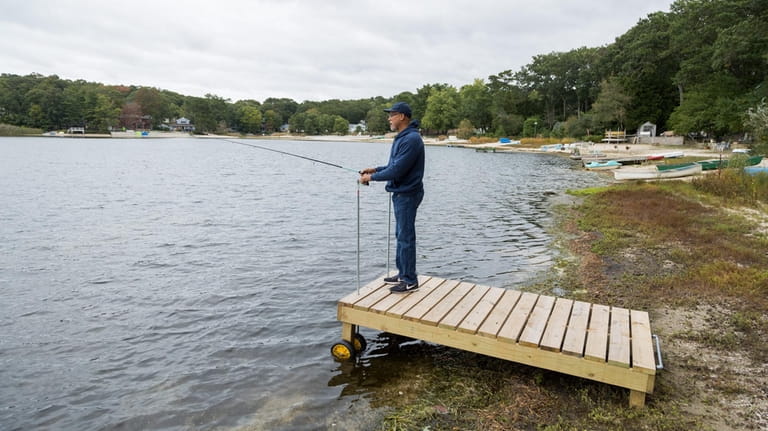 Tyrone Sellers enjoys fishing from the dock that he built...