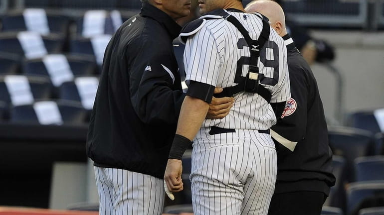 New York Yankees manager Joe Girardi takes out catcher Francisco...