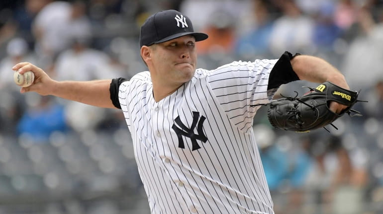 Yankees pitcher Lance Lynn delivers a pitch during Saturday's game...