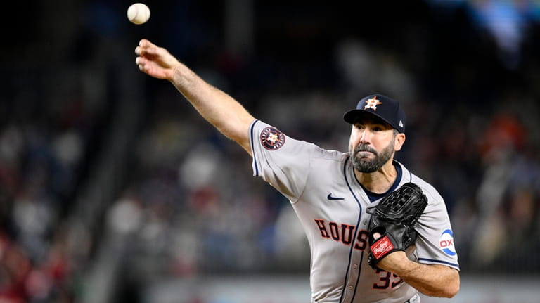 Houston Astros starting pitcher Justin Verlander throws during the fifth...