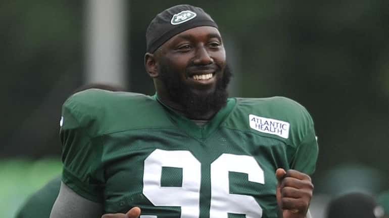 Jets' Muhammad Wilkerson stretches during training camp at the Atlantic...