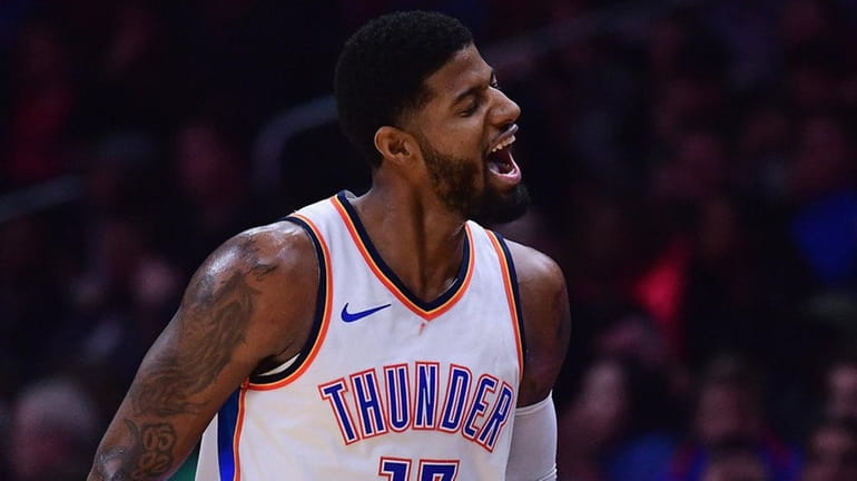 Paul George #13 of the Oklahoma City Thunder reacts to...