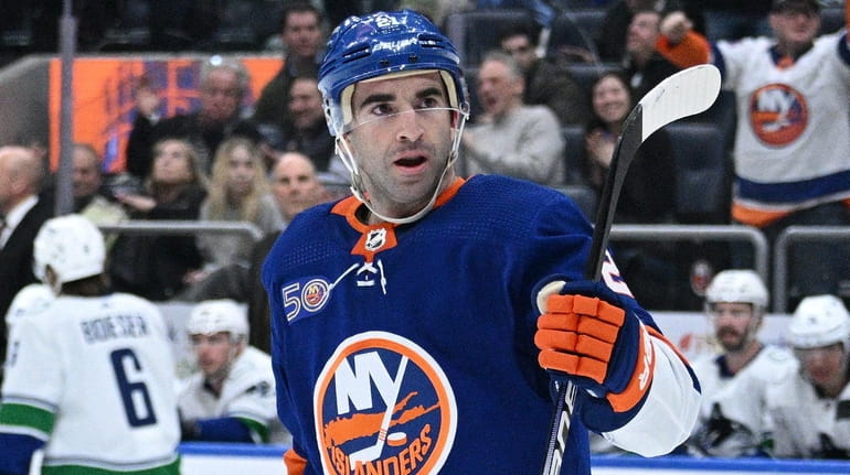 Islanders center Kyle Palmieri reacts after he scored against the...