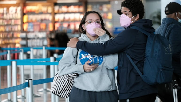Travelers wearing masks at Kennedy Airport on April 19.Unite d States...
